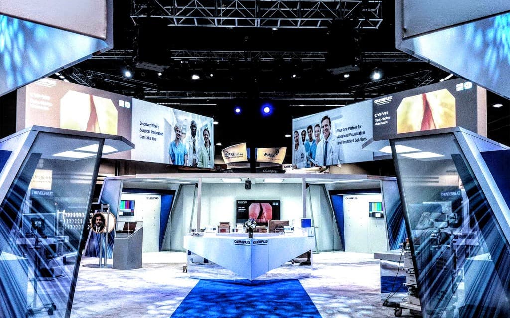 Large multi-level Olympus exhibit build in a complex venue