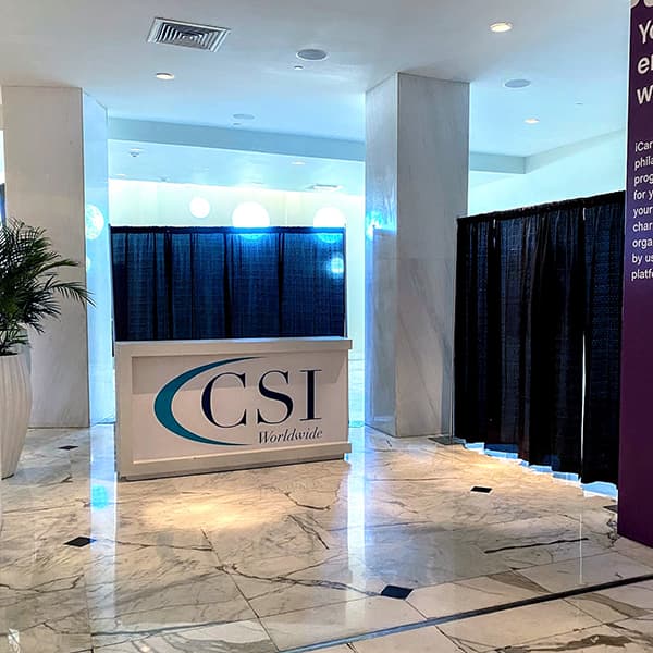 CSI Worldwide registration counter at an event venue