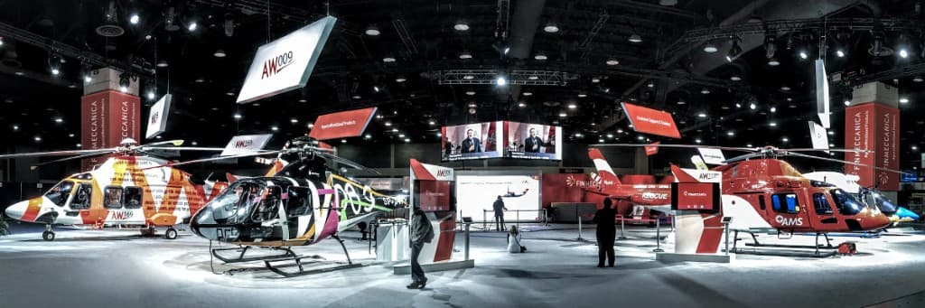 Large AgustaWestland helicopter exhibit on the show floor